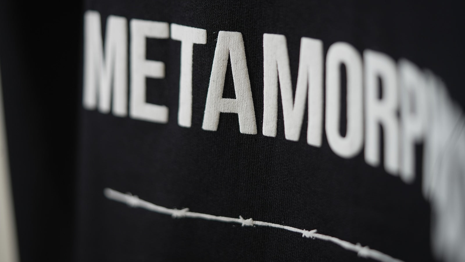 Metamorphosis - Black Tee